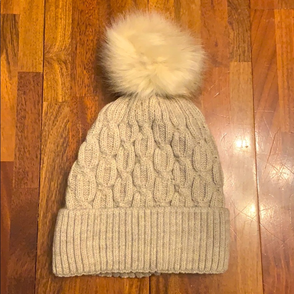 Tan Pom Pom beanie with soft inside layer